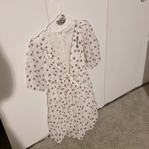 Cinch-front cotton texture mini dress with a plunging V-neckline.